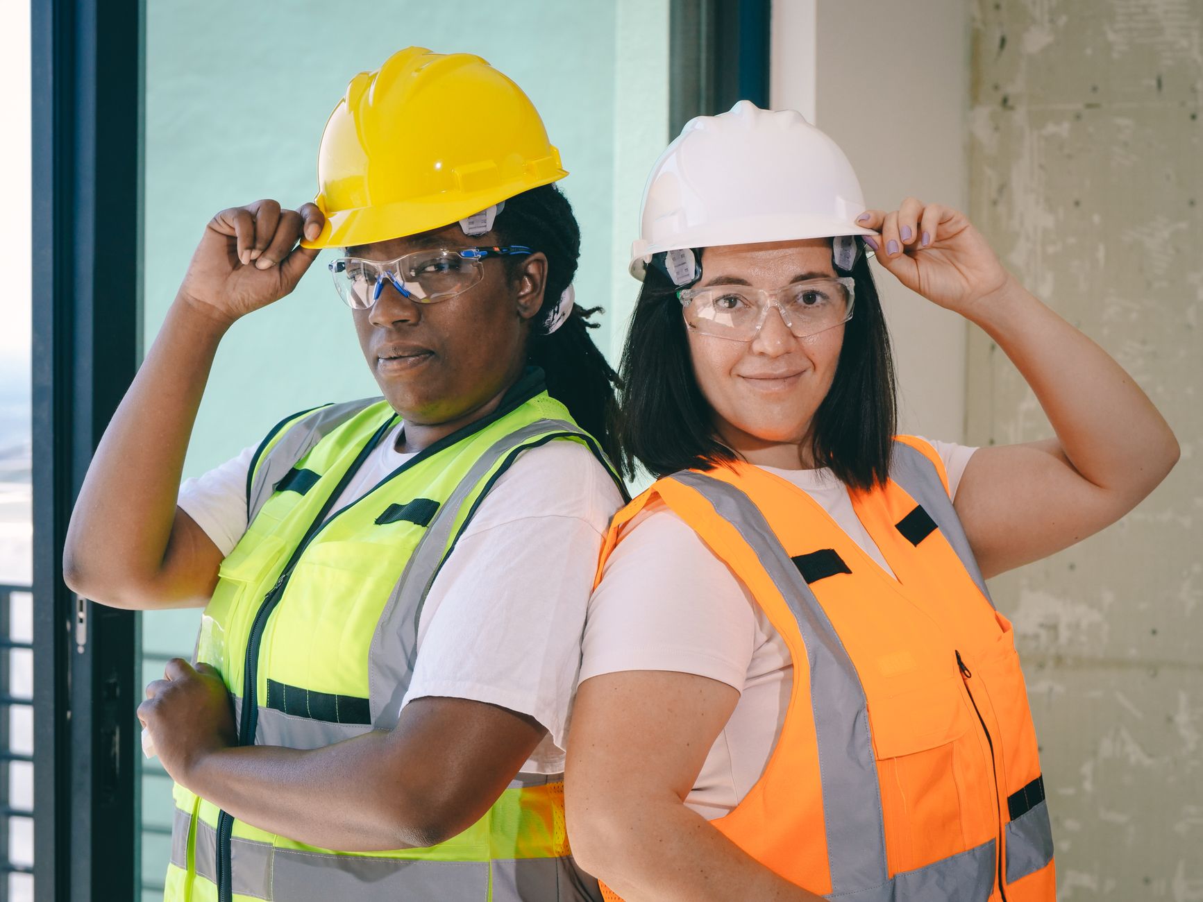 female engineers standing back to back