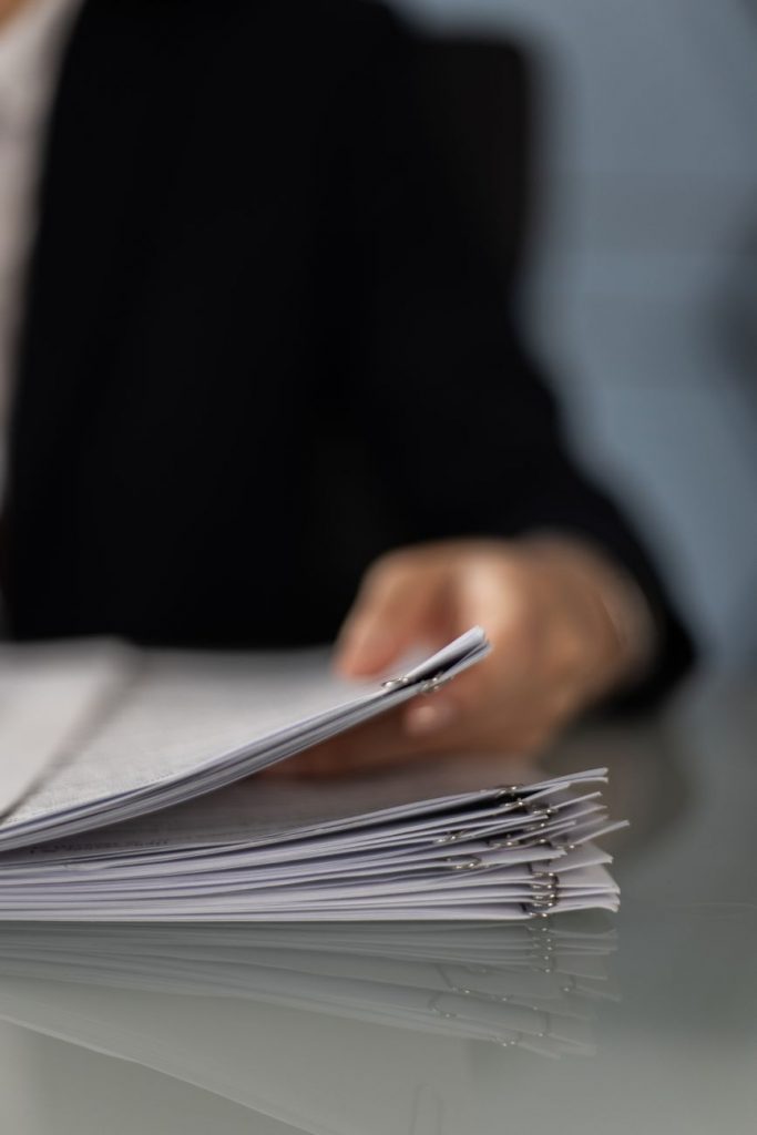 close up shot of a person holding paperwork