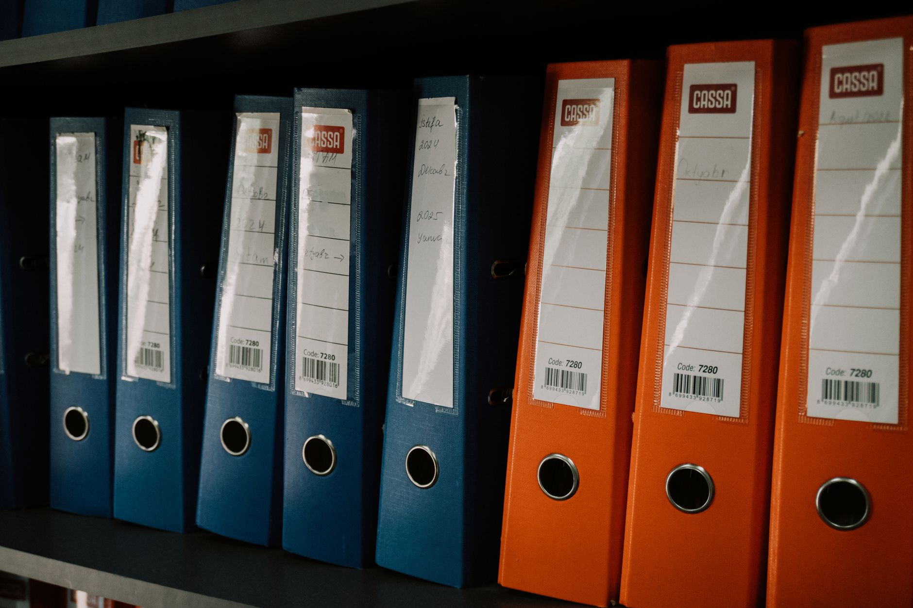 colorful office binders on shelf